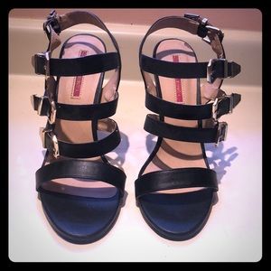 Black and gold strappy heels